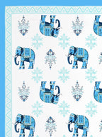Close-up of decorated sky blue elephants and aqua floral butas on a white base
