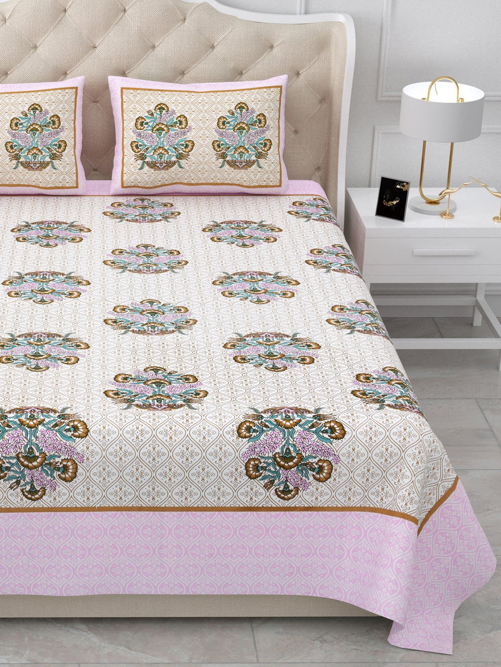 Close view of the bed showing rows of bouquet butas and the soft pink border