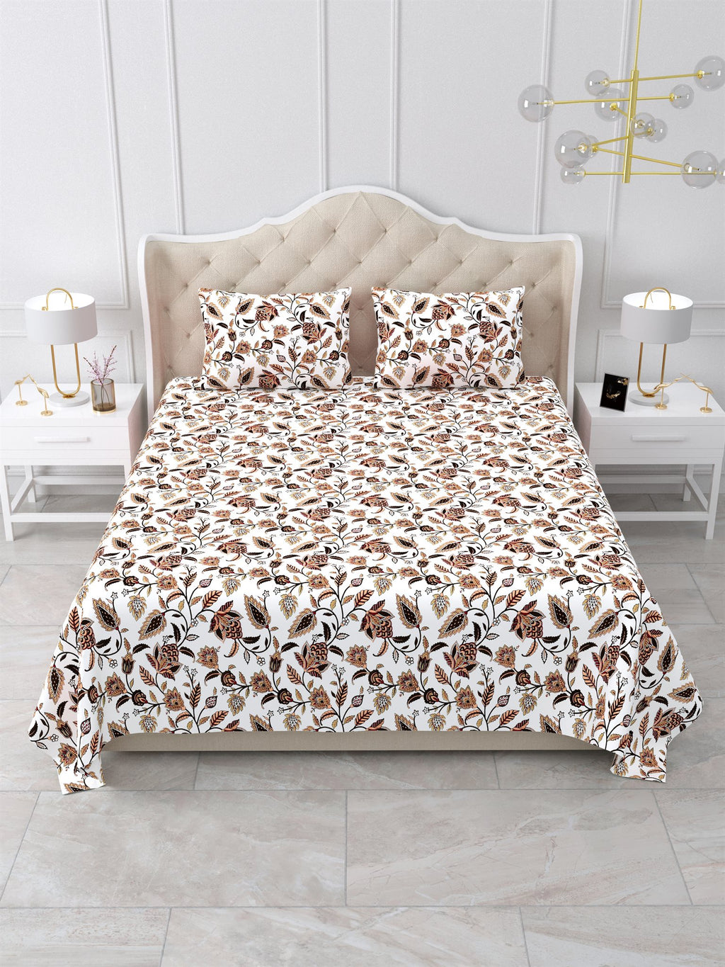 Front view of the white and rust floral vine bedsheet on a bed with 2 matching pillow covers