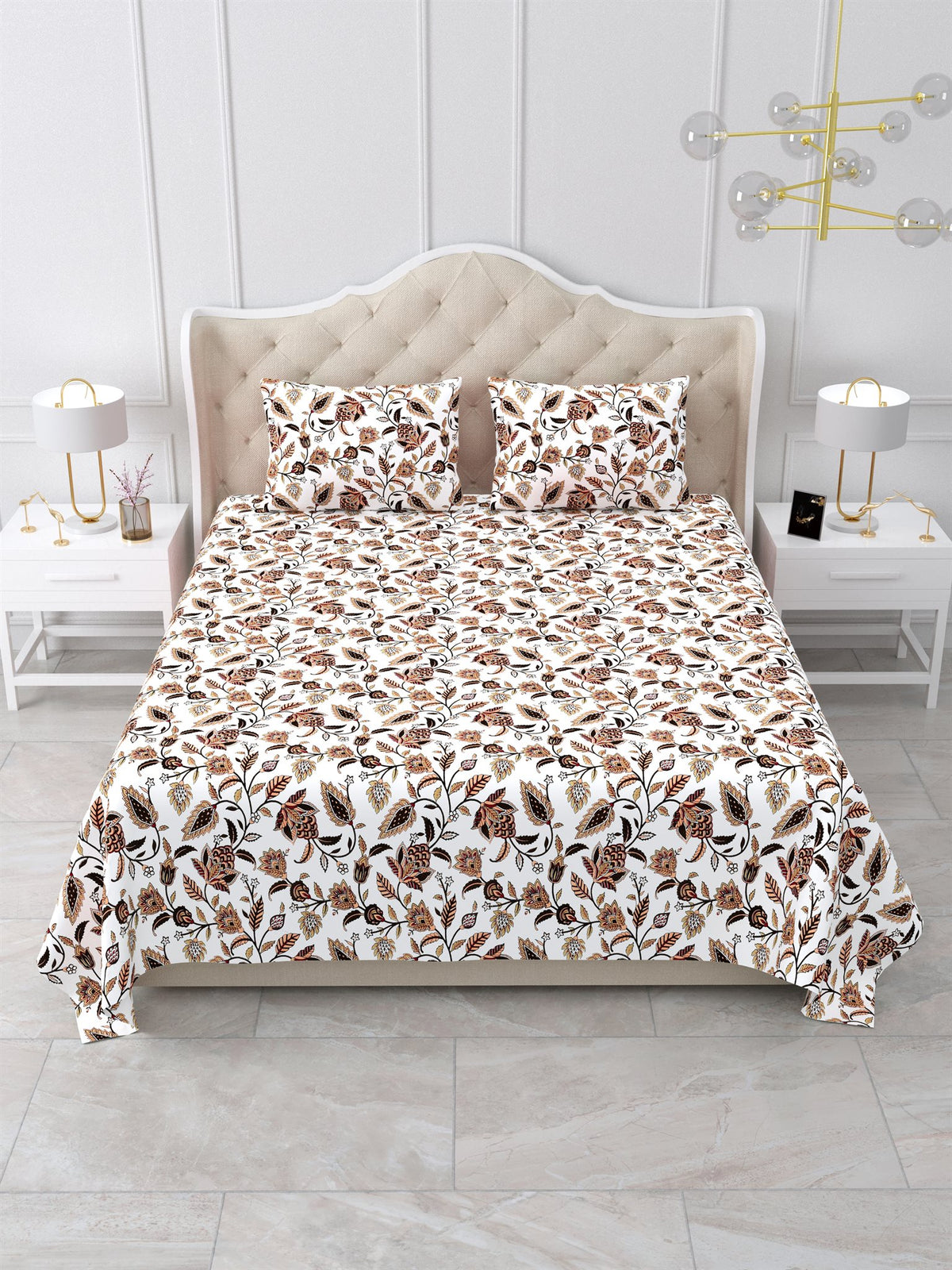 Front view of the white and rust floral vine bedsheet on a bed with 2 matching pillow covers